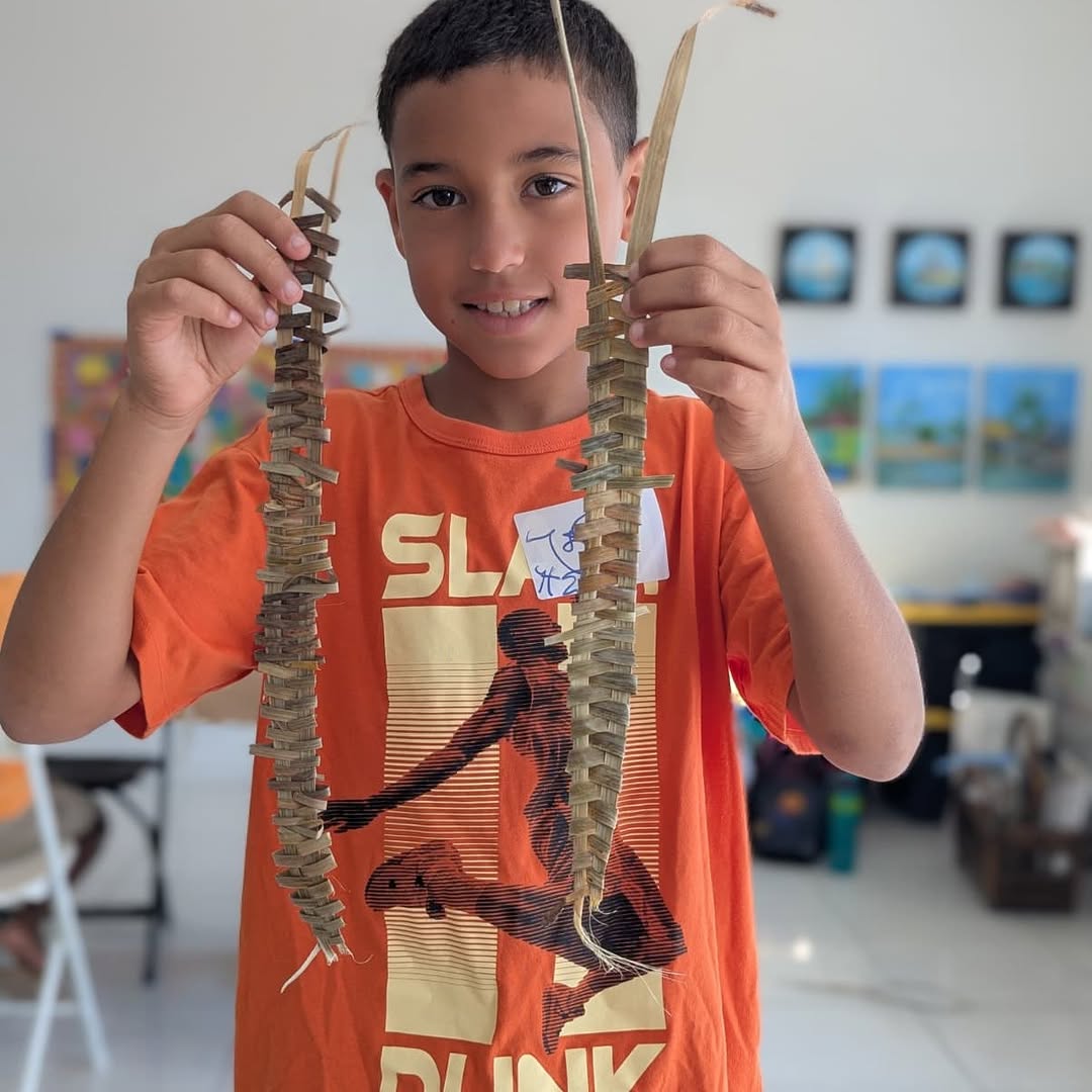 Exuma Arts Network Gallery: visitor engaging with art