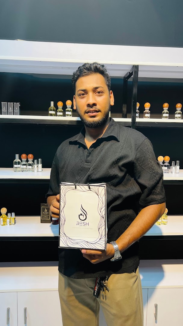 Resh Perfumes: professional staff showcasing shop products