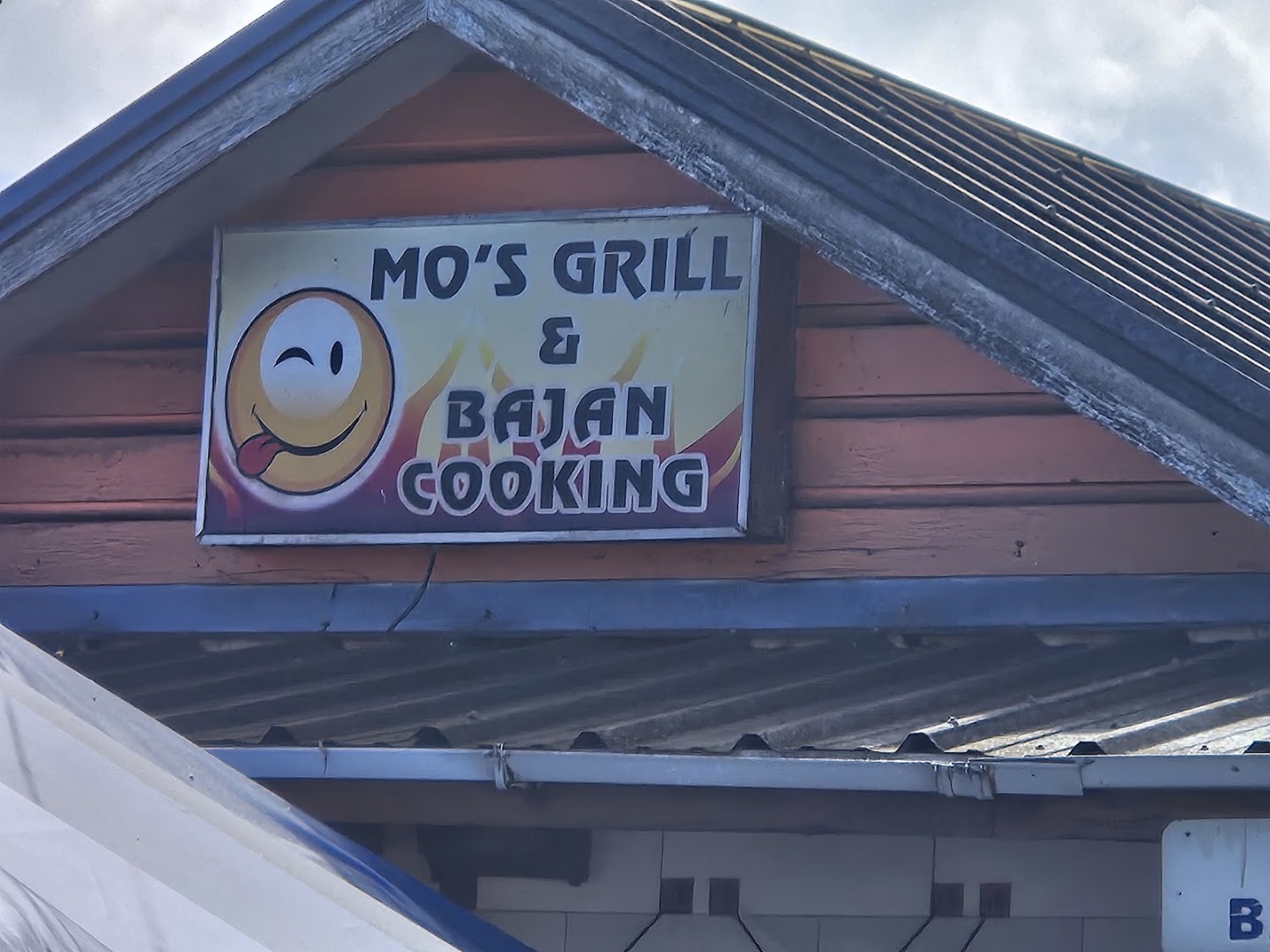 Mo's Grill and Bajan Cooking: clear photo of restaurant signage