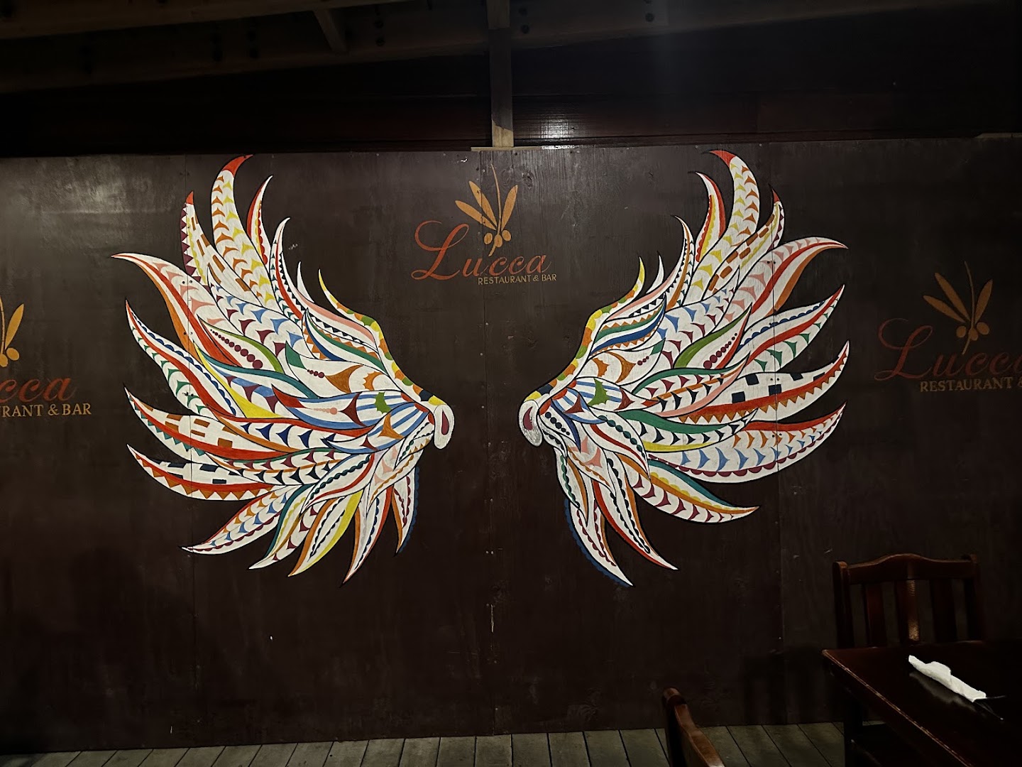 Lucca Restaurant & Bar: attractive mural branding the venue