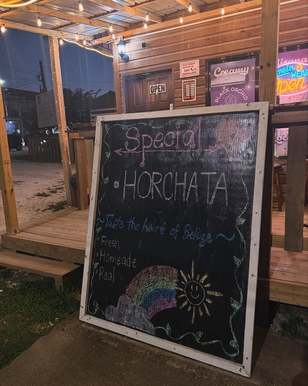 Black Orchid Ice Cream: inviting storefront with menu board