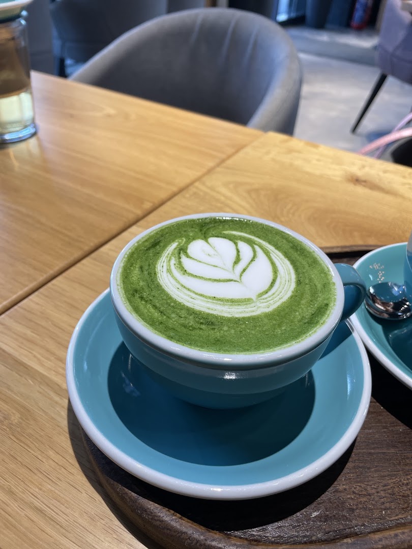 The Family Coffee Roasters: high quality latte art photo