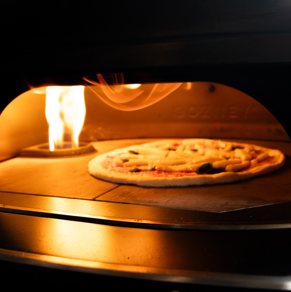 Proof Pizza Bar & Cafe: appetizing photo of pizza cooking
