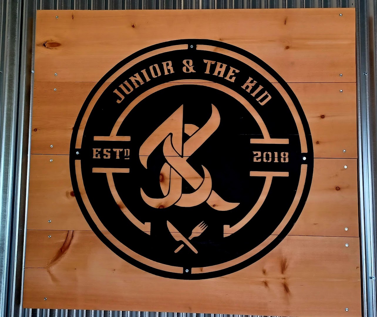 Junior & The Kid: clear photo of venue signage