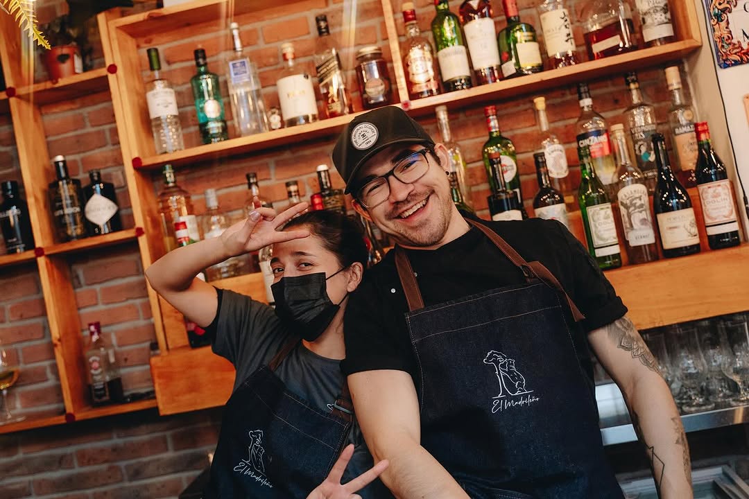 El Madrileño: friendly staff in restaurant setting