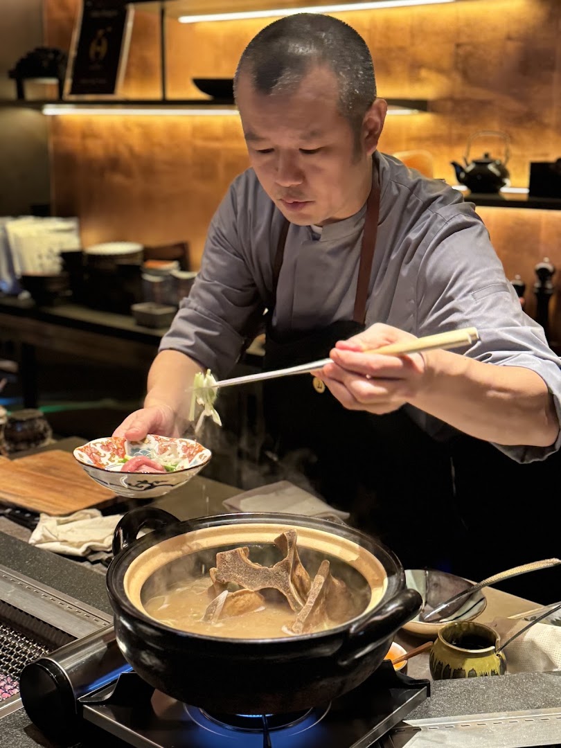 Yakiniku Yama Oku: professional photo of chef cooking