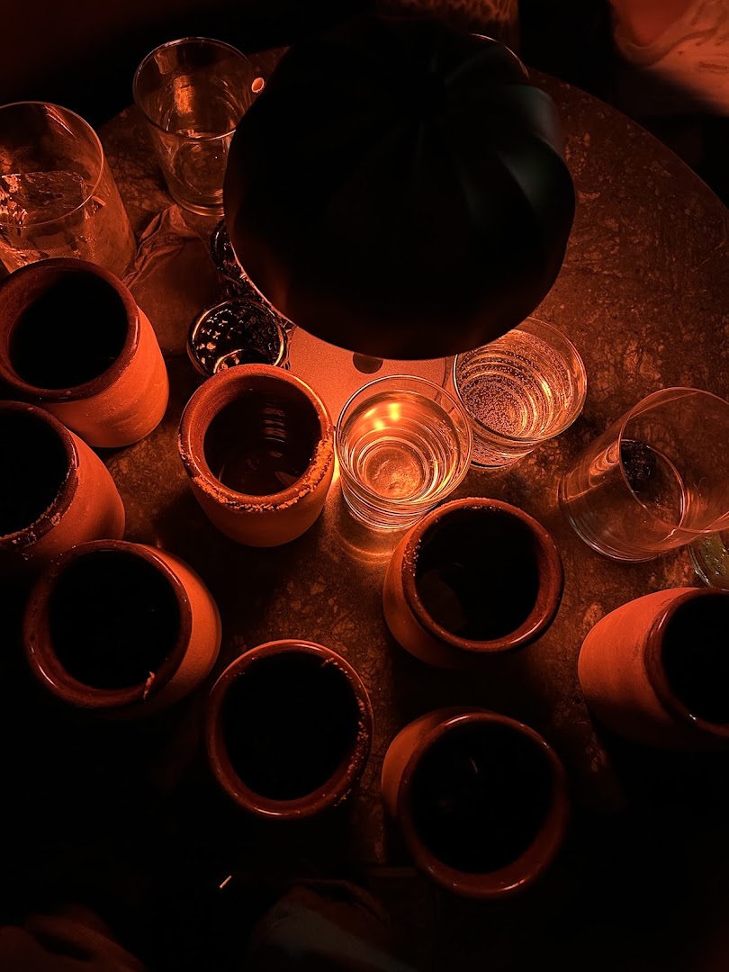 Petit Comité: atmospheric shot of bar drinks