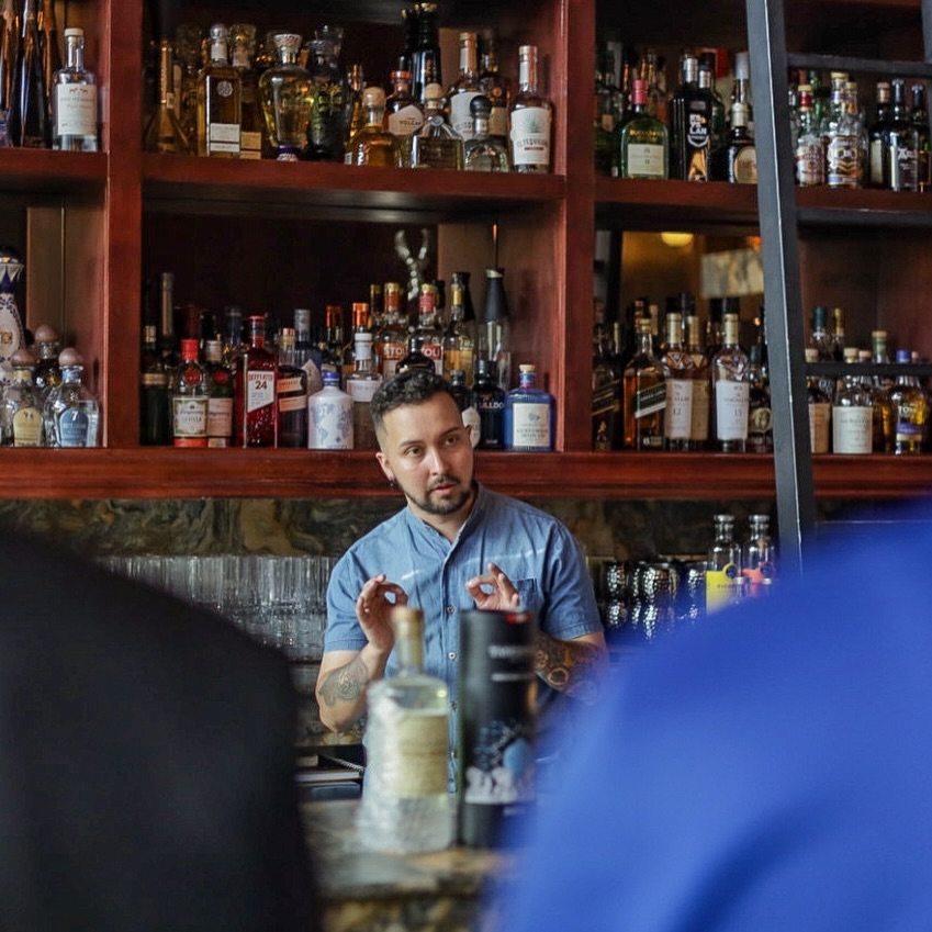 The Lobby Bar: professional shot of bartender working