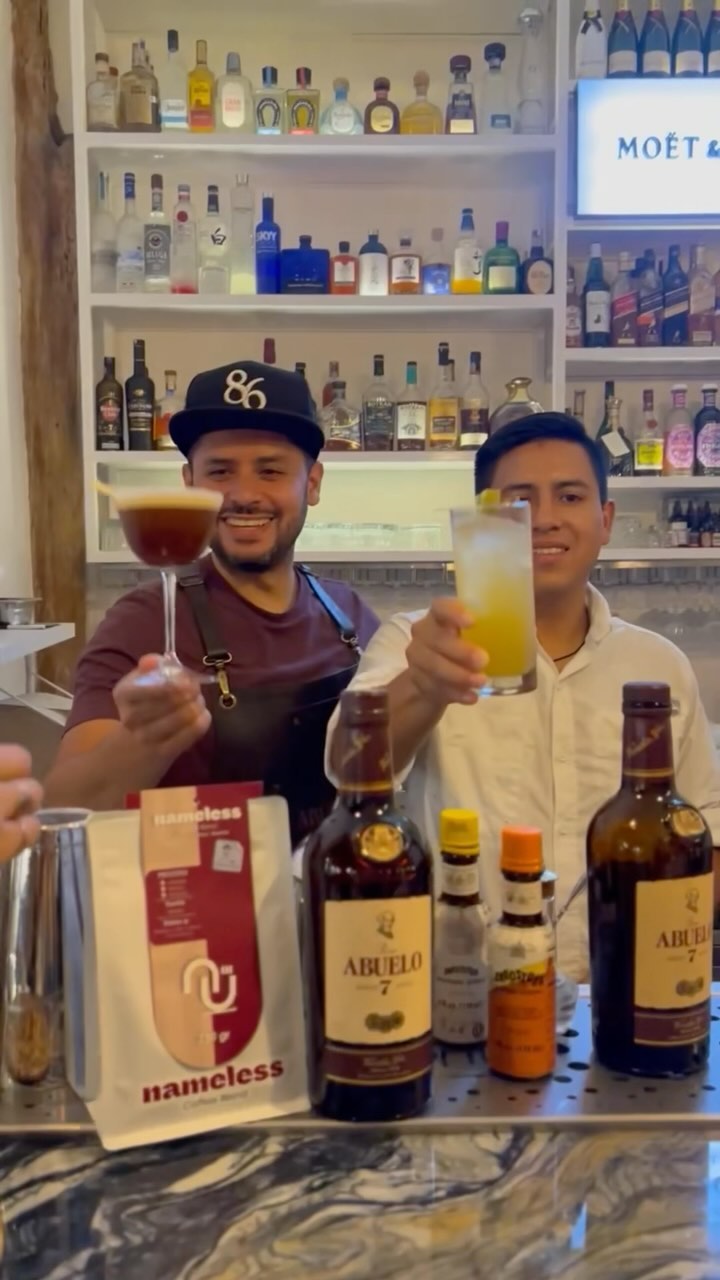 Isla Grill: friendly staff showcasing signature drinks