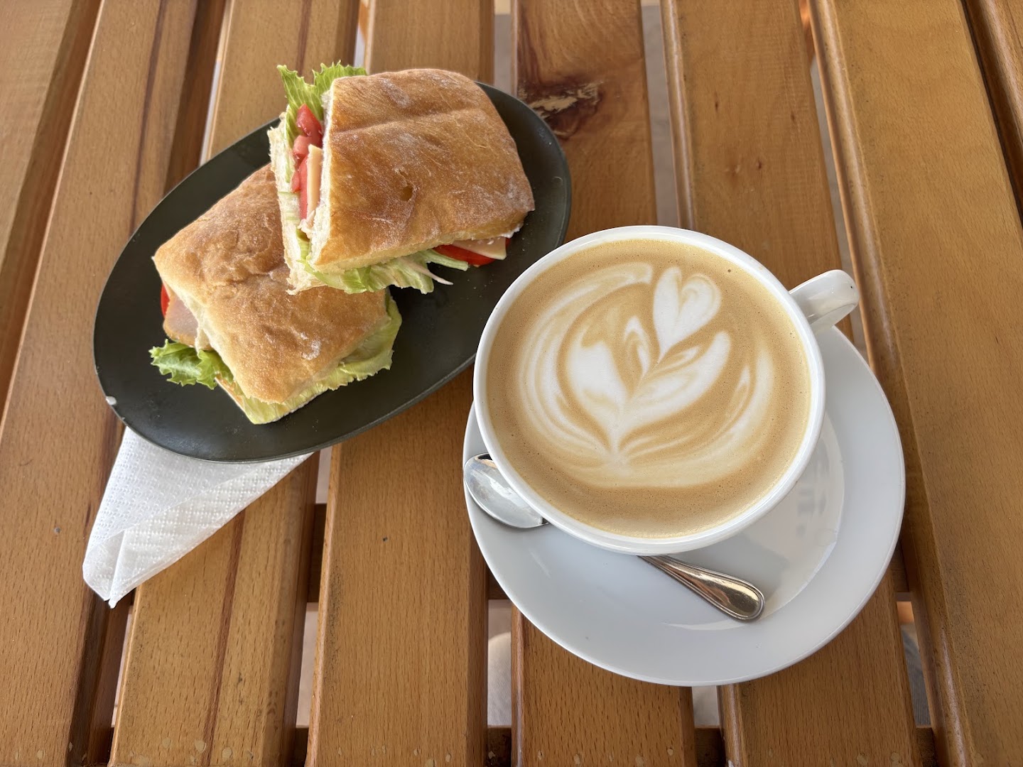 Caffeine Specialty Coffee: appetizing photo of coffee and sandwich
