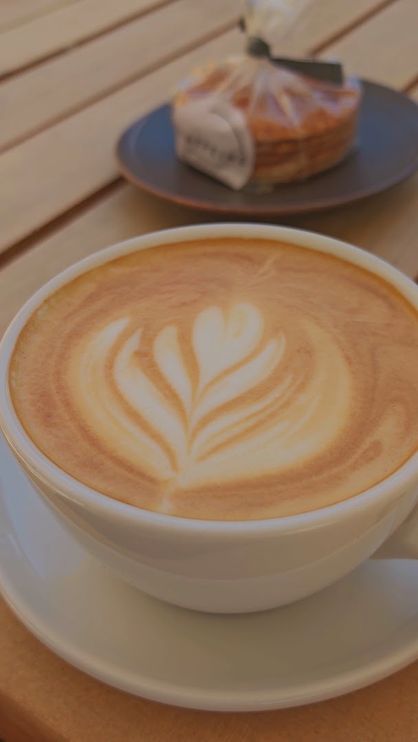 Caffeine Specialty Coffee: appetizing coffee and pastry photo