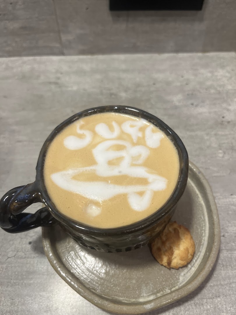 Surf Café: appealing latte art coffee photo