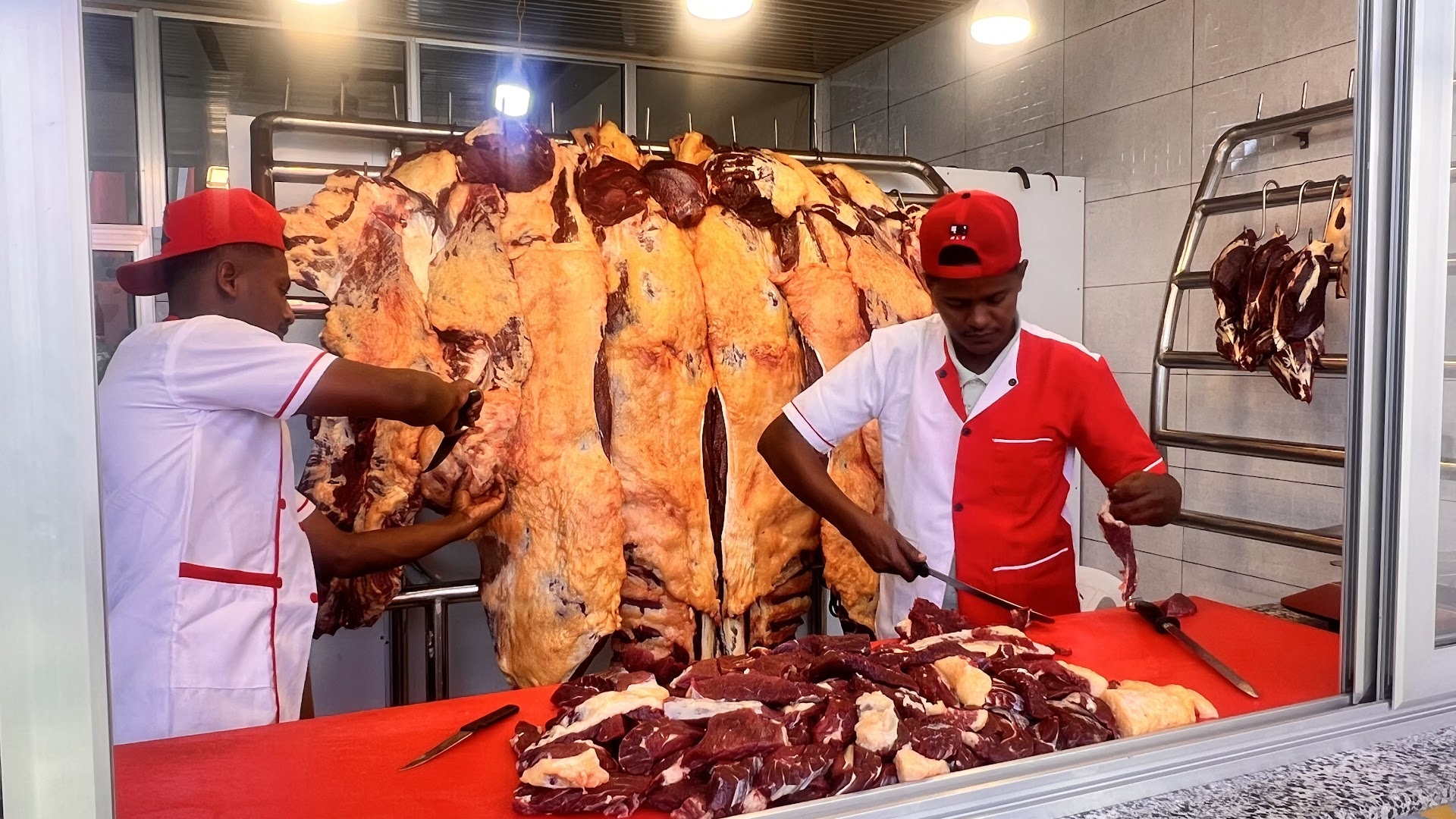 Kogna Kurt and Lounge: staff preparing fresh meat