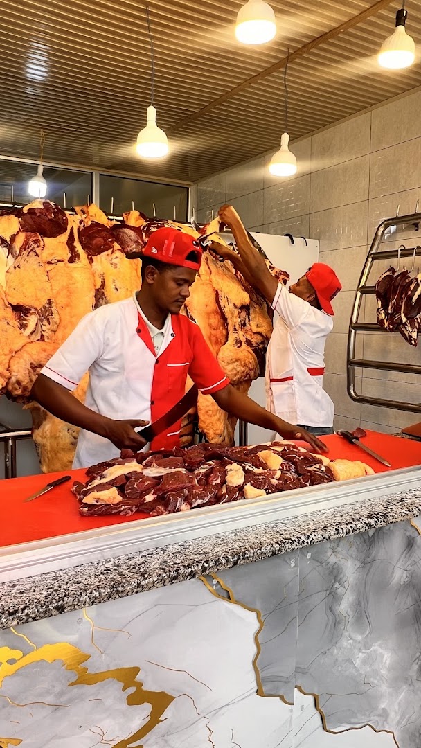 Kogna Kurt and Lounge: staff preparing fresh meat