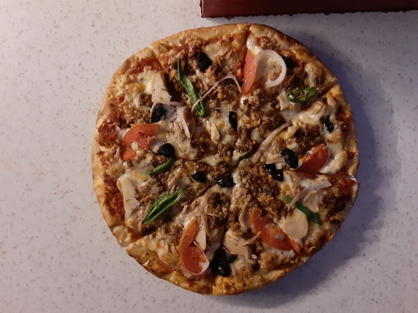 Retina Pizzeria & Cafe: appetizing photo of restaurant pizza