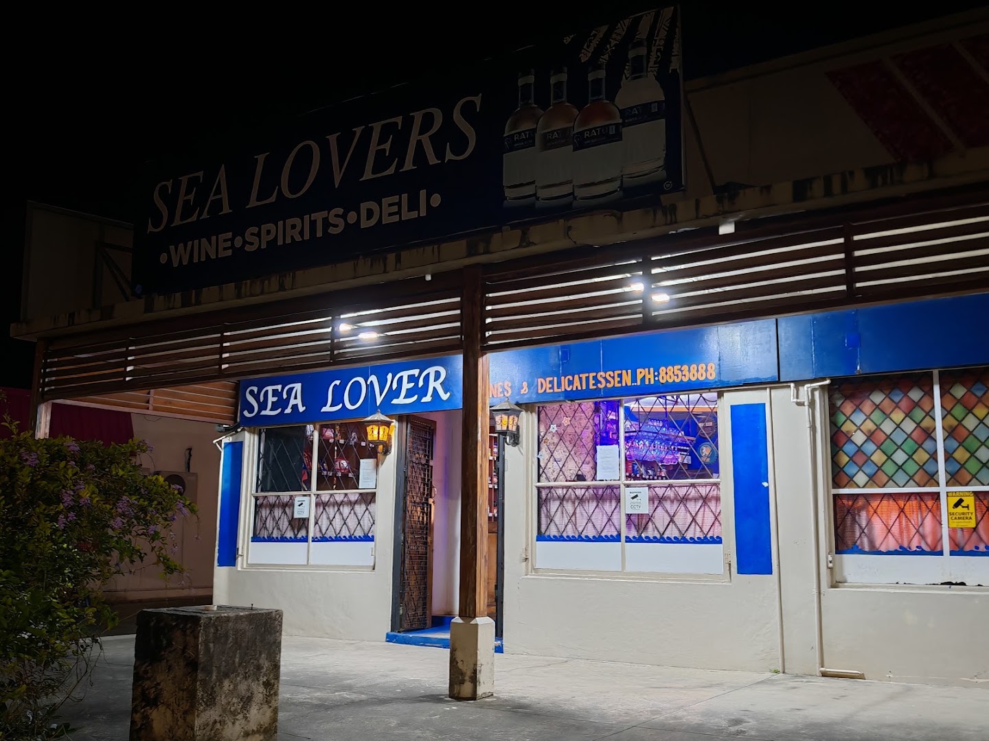 Sea Lovers Wines & Spirits: clear storefront photo at night