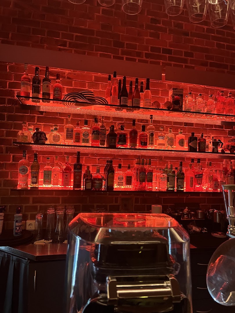 Encanto: atmospheric bar interior and bottles