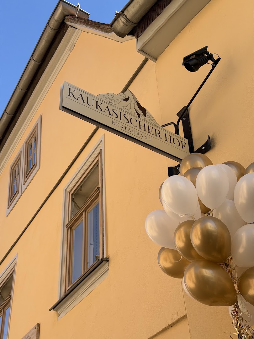Kaukasischer Hof: clear, professional exterior signage photo