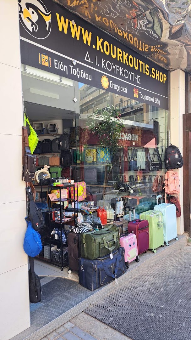 Kourkoutis Travel & Bags: clear storefront showing shop products