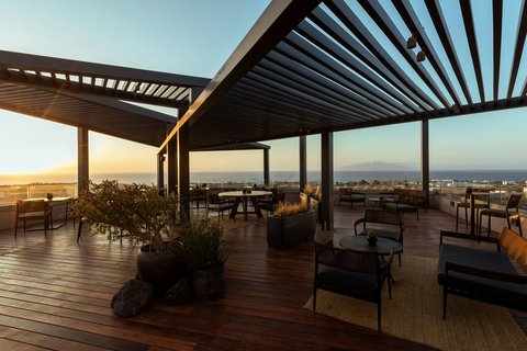 Domes Novos Santorini, Autograph Collection: beautiful hotel terrace sunset view