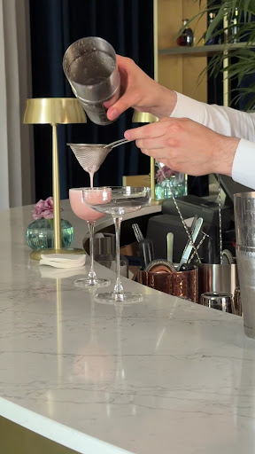Velvet Bar & Café: professional cocktail preparation shot
