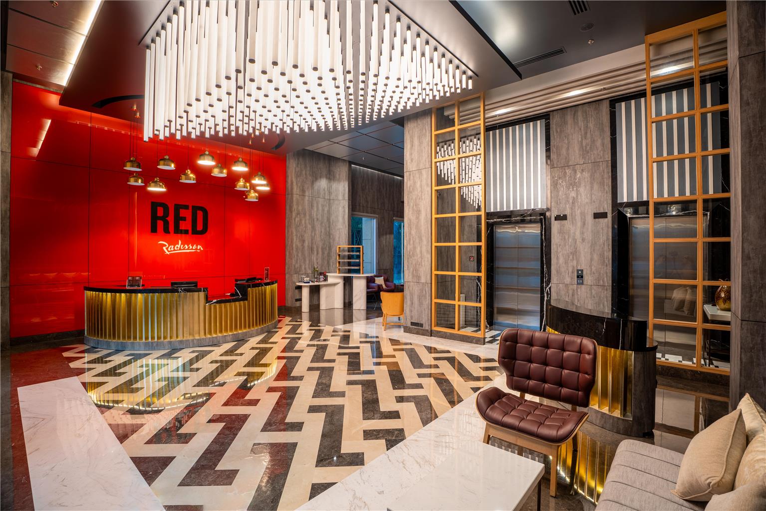 Radisson RED Indore: professional hotel lobby interior shot