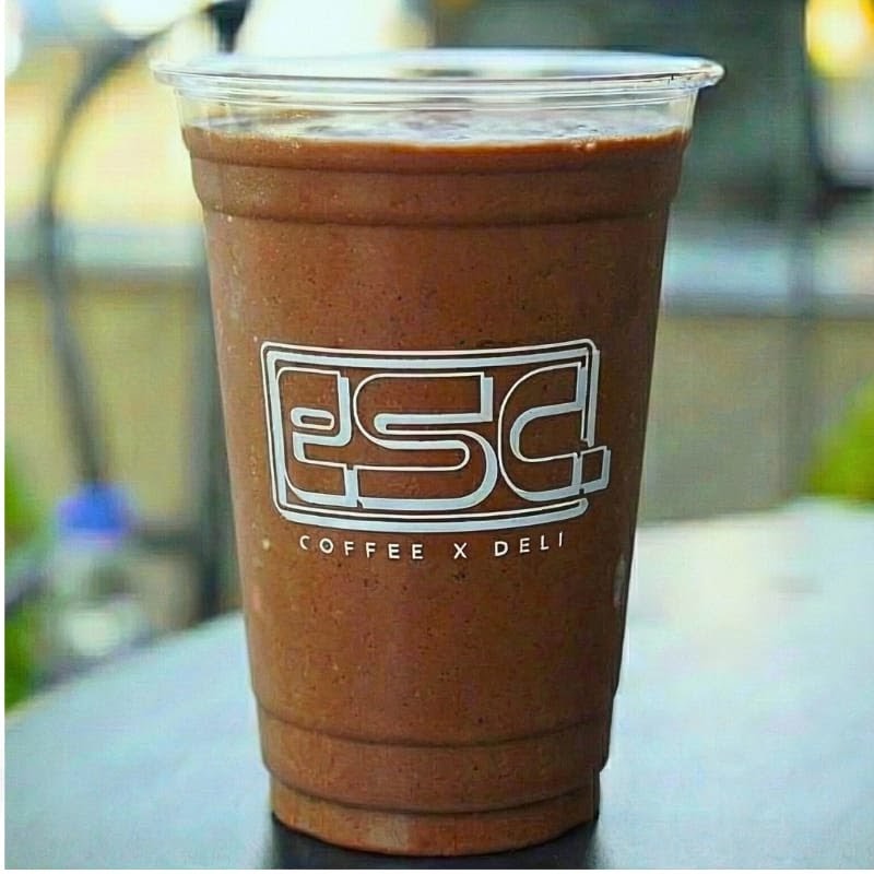 esc. Coffee x Deli: clear photo of branded drink