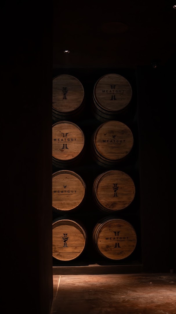 Meatguy Steakhouse II: atmospheric interior shot of barrels