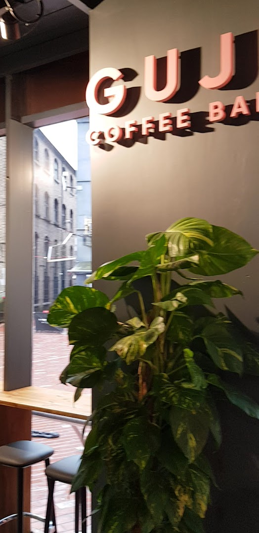Guji Coffee Bar: clear branding and inviting atmosphere