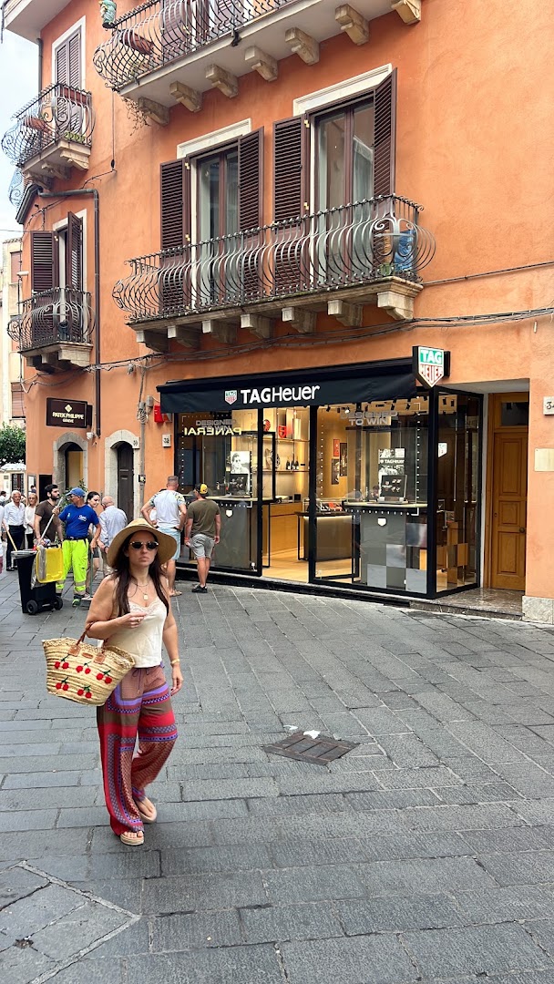 Rocca Boutique TAG Heuer: clear storefront view with branding