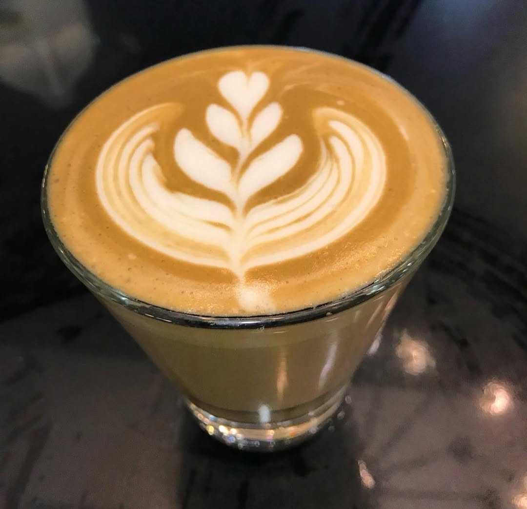 Crumbles Café and Delicacies: high quality latte art photo