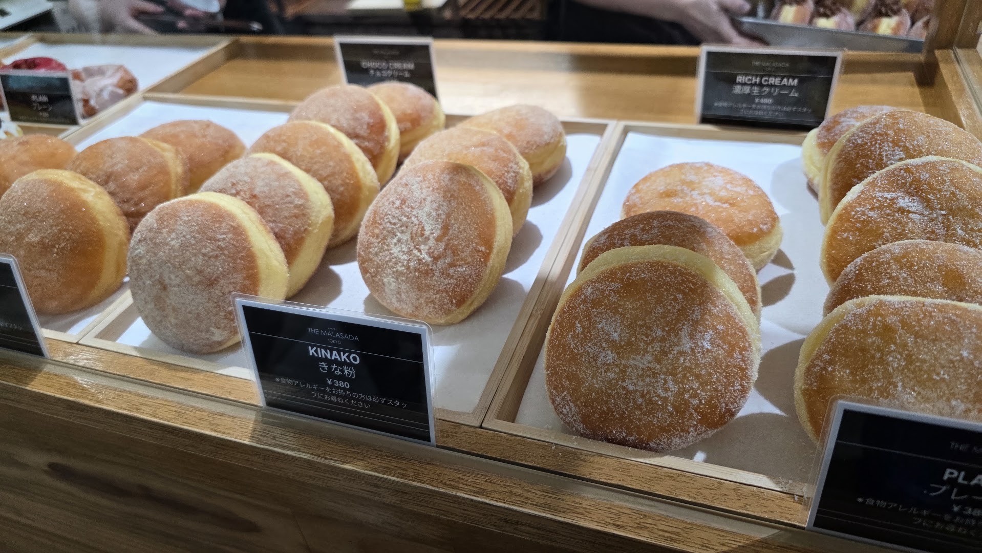 The Malasada Tokyo Naha: appetizing display of fresh malasadas
