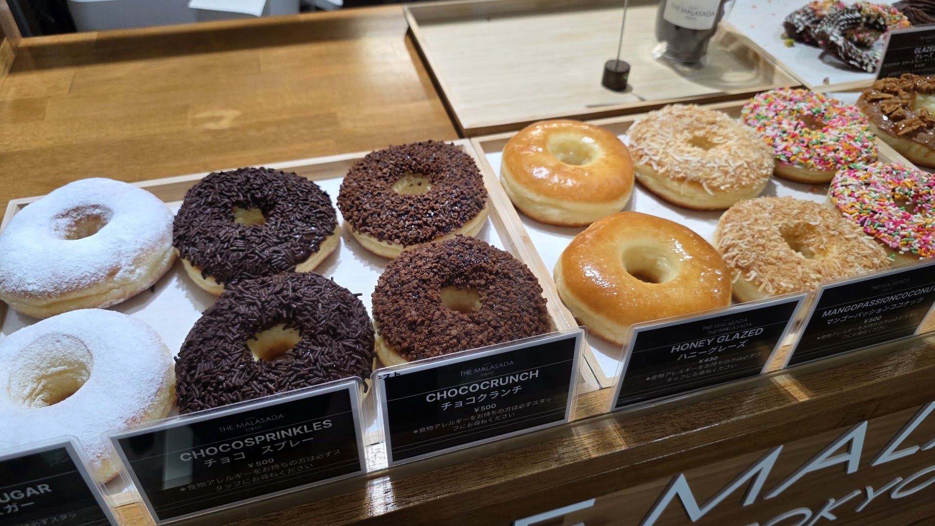 The Malasada Tokyo Naha: appetizing display of fresh donuts