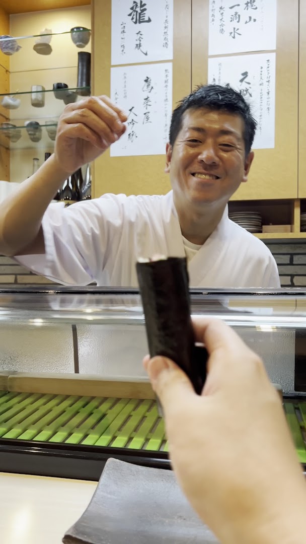 Matsuzushi: engaging photo of chef serving