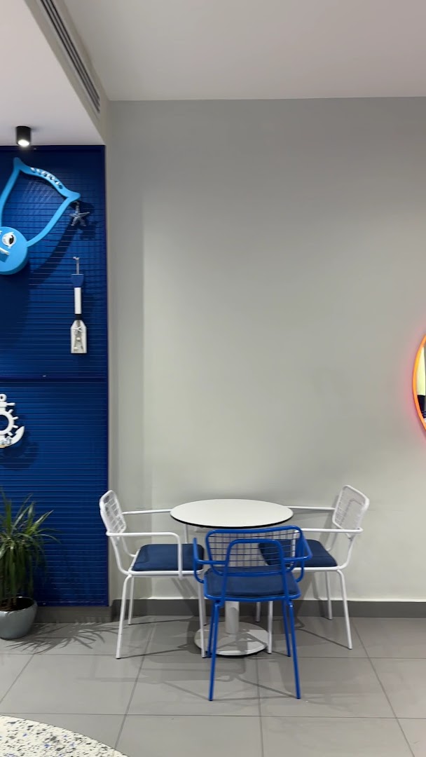 Comma Coffee Aqaba: clean and inviting interior shot