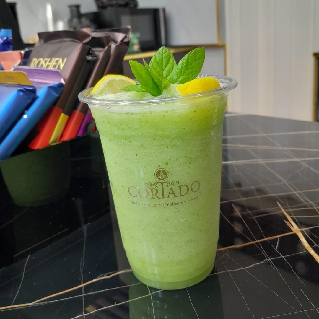Cortado Coffee House: appetizing drink photo with branding
