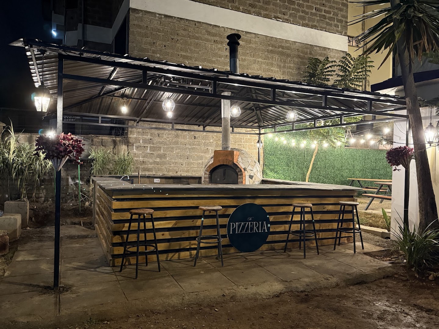 The Pizzeria: attractive, well-lit restaurant exterior