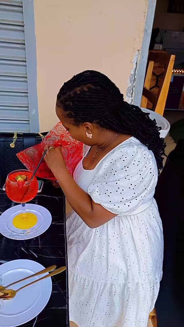 Scoopy's Ice Cream: customer enjoying drink at venue