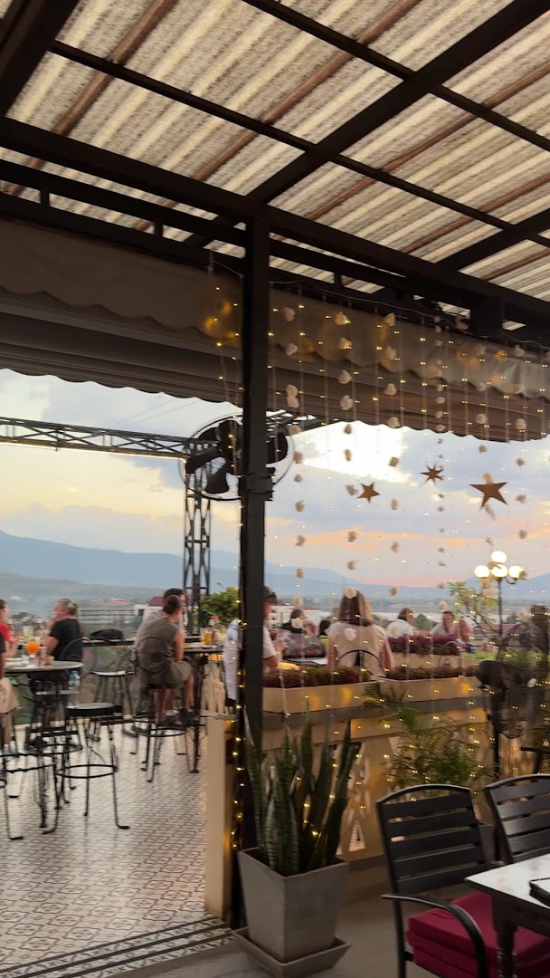 Le Panorama Rooftop Restaurant: inviting atmosphere and scenic view