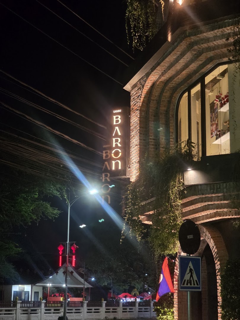 Baron Vientiane: attractive night shot of exterior
