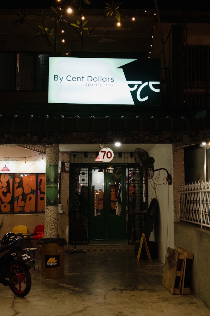 By Cent Dollars: clear storefront photo at night