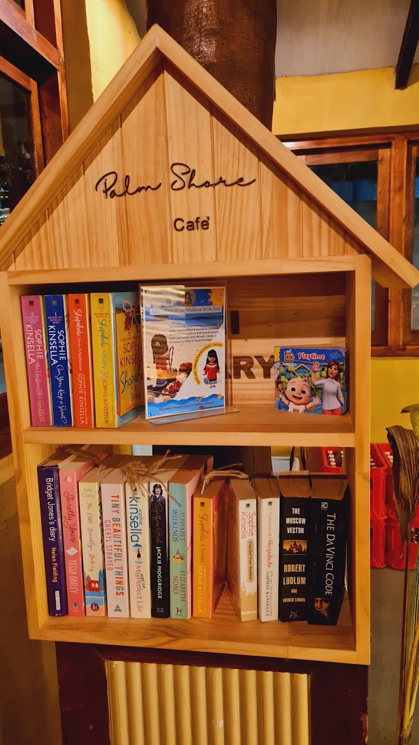 Palm Shore Cafe: charming cafe bookshelf decor