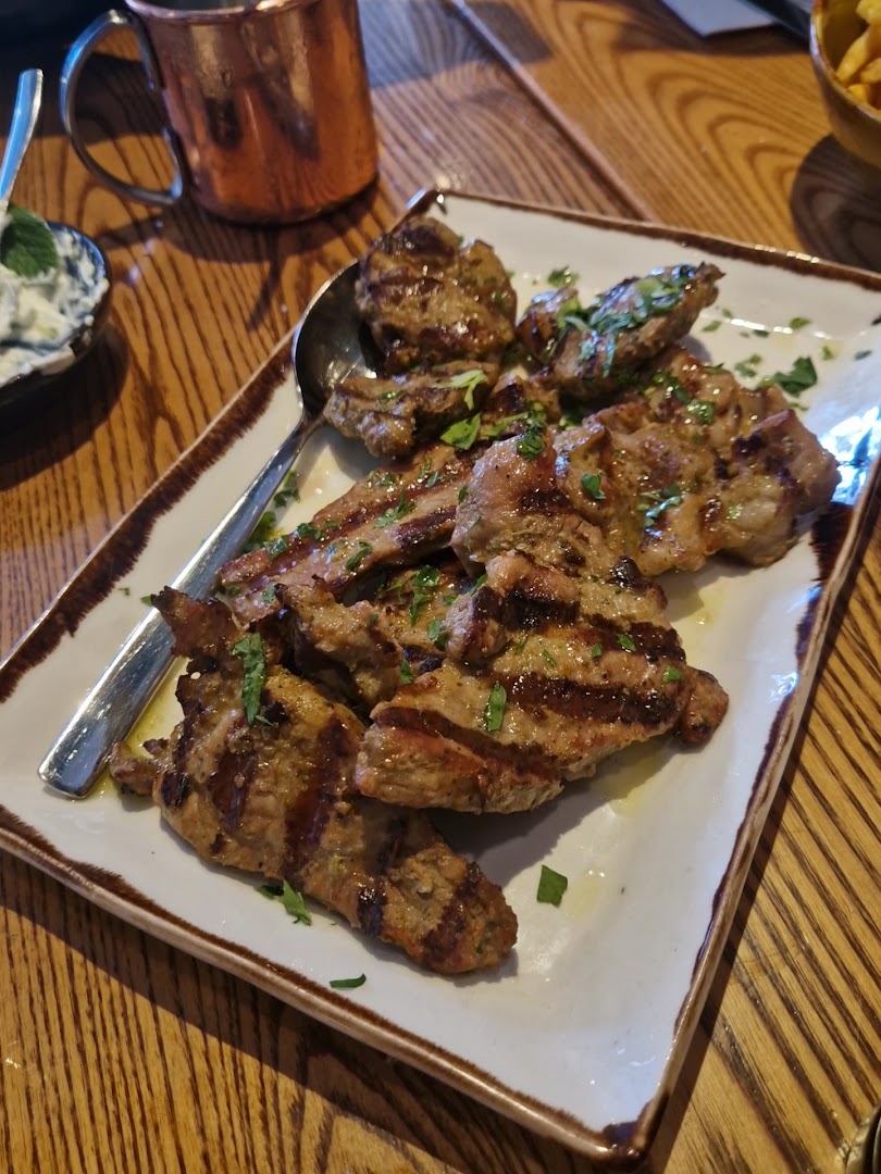 Manakis: appetizing photo of grilled meat
