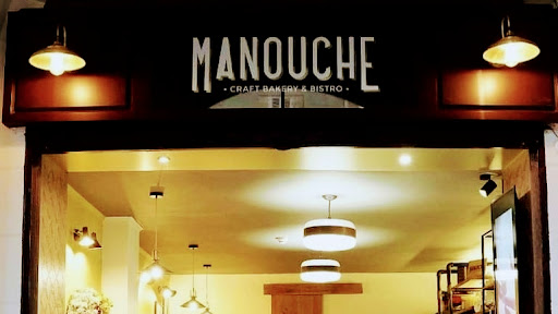 Manouche: clear, professional shot of storefront