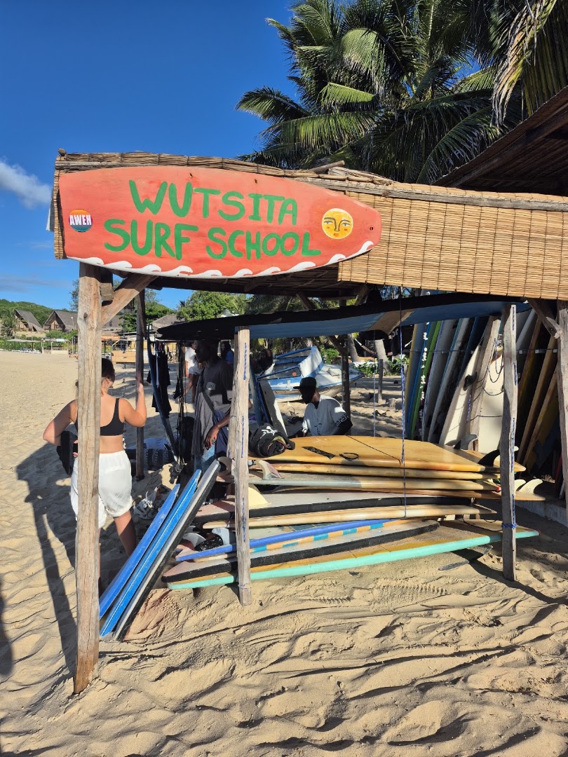 Wutsita Surf School: clear storefront showing surf equipment