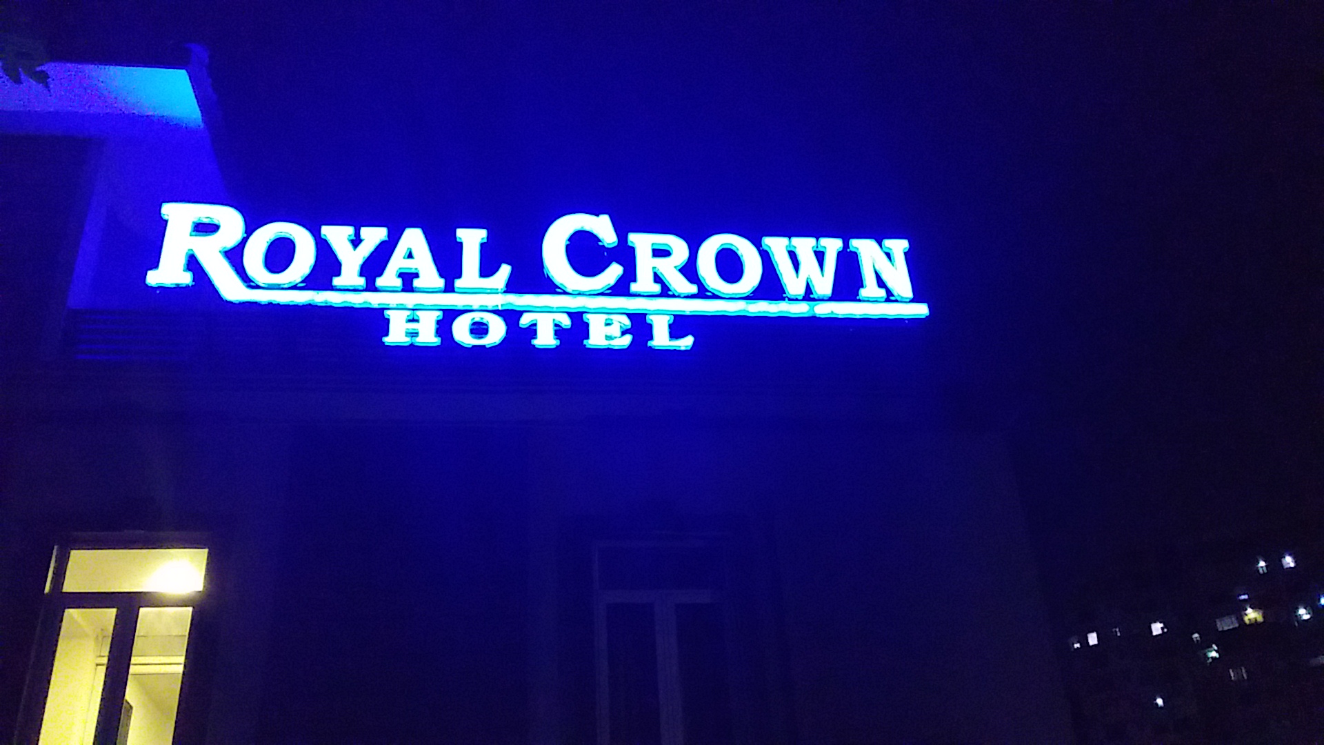 Royal Crown: clear exterior signage at night