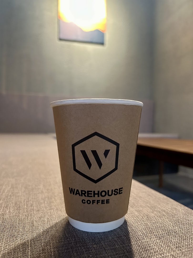Warehouse Coffee Lounge: clear branded coffee cup photo