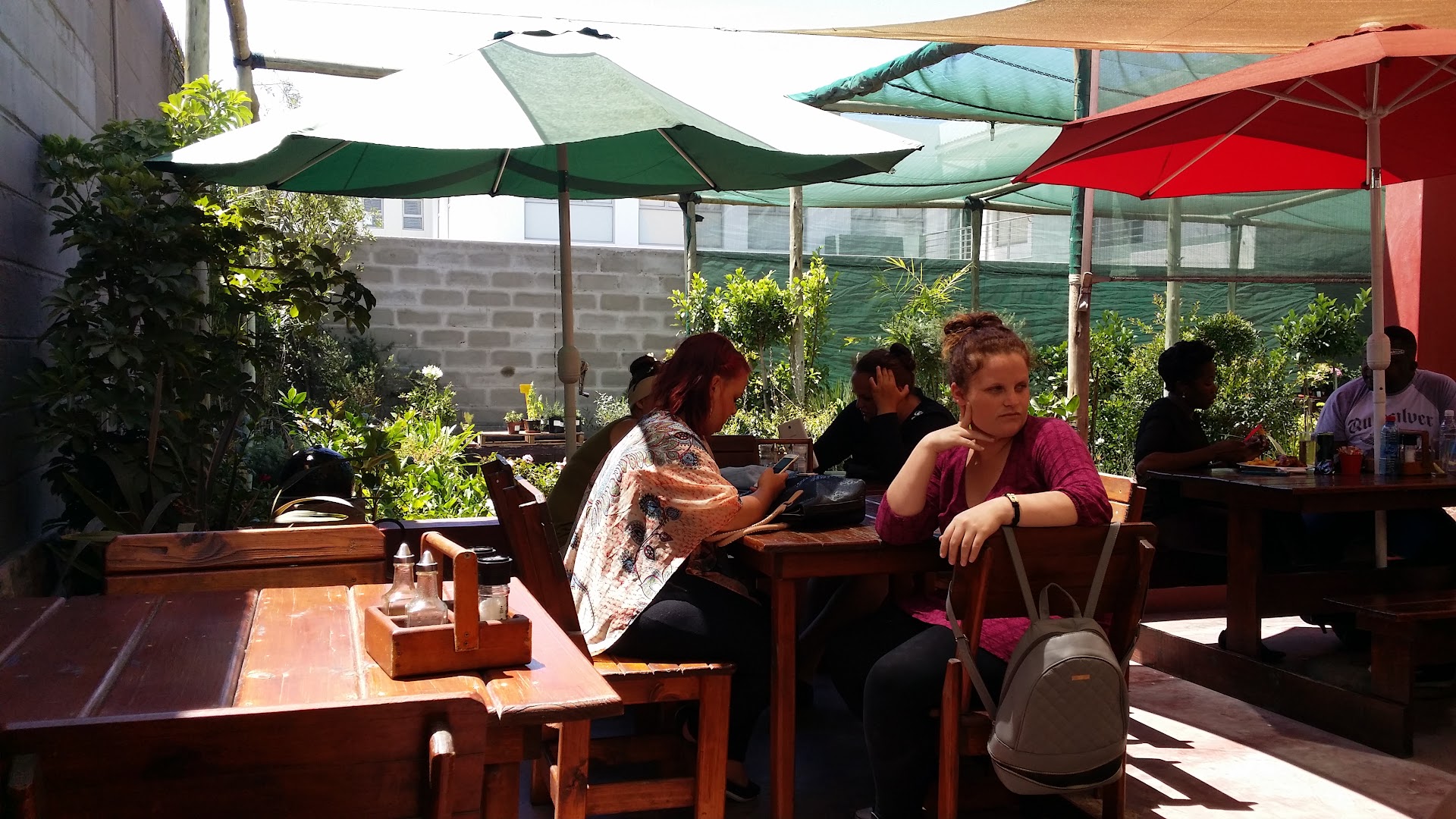 Vlooi's Nest at The Place: inviting outdoor dining atmosphere