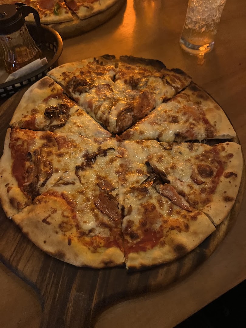 Sauced Pizza: appetizing photo of restaurant pizza