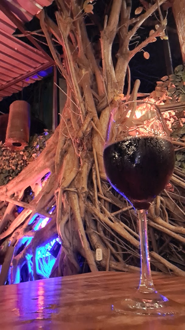Sauced Pizza: atmospheric shot of wine